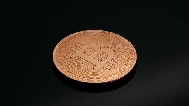 Bitcoin cryptocurrency cooper coin on the black backround