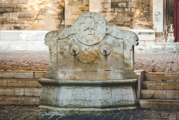 Fountain Saint Jean de Malte decorated with cross, symbol of Maltese Order in Aix-en-Provence,...