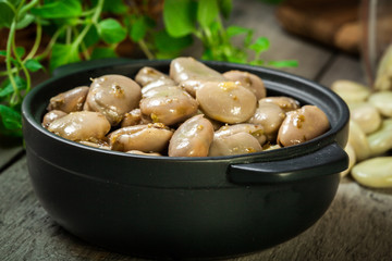 Broad beans stewed with onion and oregano