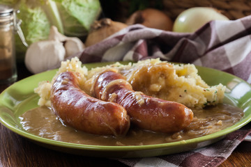 Bangers and Mash. Baked sausage in onion gravy