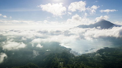 Batur volcano and lake under blue sky