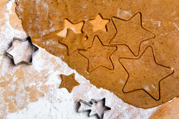 Preparing Christmas gingerbread cookies. Gingerbread dough and star shape cookies ingredients.