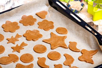 Fototapeta na wymiar Preparing Christmas gingerbread cookies. Gingerbread dough and cookies ingredients.