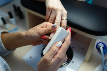 Obraz premium Nail care of nails for applying a beautiful nail Polish