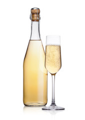 Bottle and glass of yellow champagne with bubbles