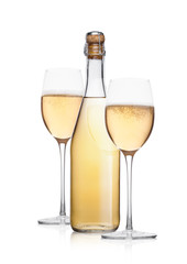 Bottle and glass of yellow champagne with bubbles