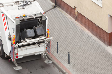 Garbage dustcart truck on city street