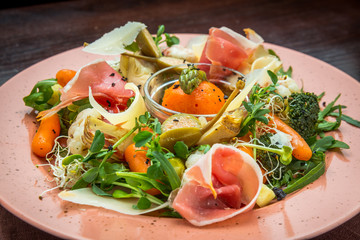 Fresh salad from vegetables, cheese and ham