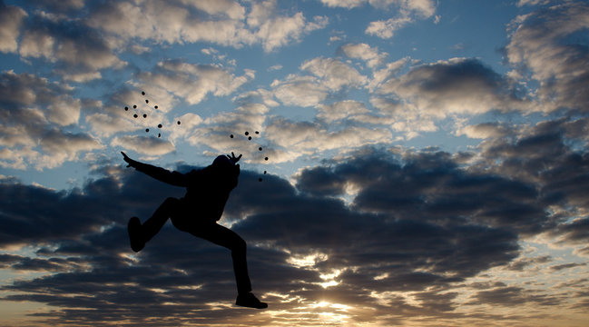 Men jump action on sunset area siluate style.