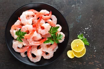 Foto auf Acrylglas Meeresfrüchte Prawns on plate. Shrimps, prawns. Seafood. Top view. Dark background