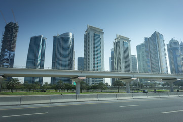 Fototapeta na wymiar Sheikh Zayed road with skyscrapers at sun