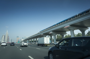 View from Side of Car Going on the new asphalt road. Metro line near the highway