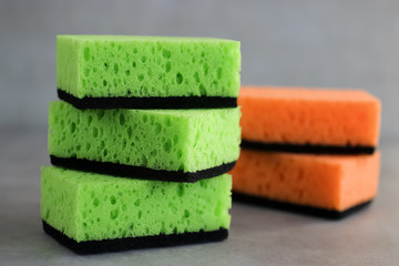 Household cleaning sponges for cleaning on gray  background.