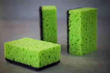 Household cleaning sponges for cleaning on gray  background.