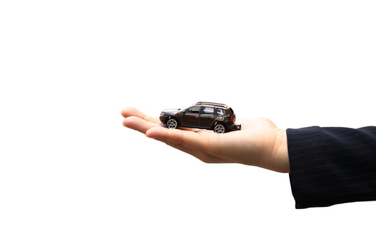 Businesswoman or saleswoman holding miniature car model, auto business, car trading, loans for car concept