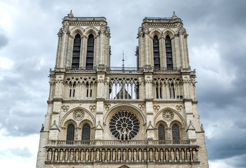 Fototapeta na wymiar Notre-Dame Cathedral on Cloudy sky in Paris, France