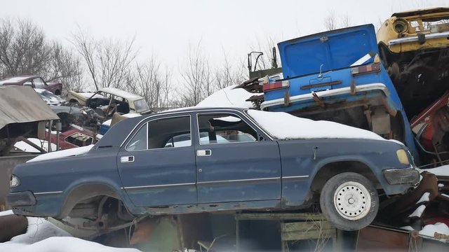 old auto scrap metal dump abandoned landfill outdoors disposal video vehicles cars the winter