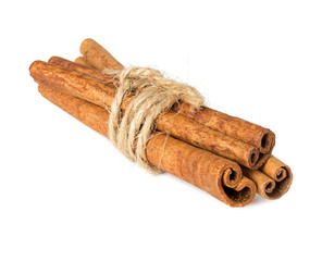 Cinnamon sticks tied with string, isolated on white