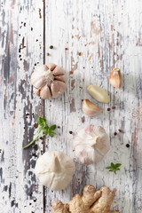 Garlic on an old wooden table. The view from the top.