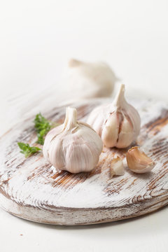Garlic on a kitchen Board on white background