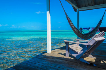 Obraz premium Belize Cayes - Small tropical island at Barrier Reef with paradise beach - known for diving, snorkeling and relaxing vacations - Caribbean Sea, Belize, Central America