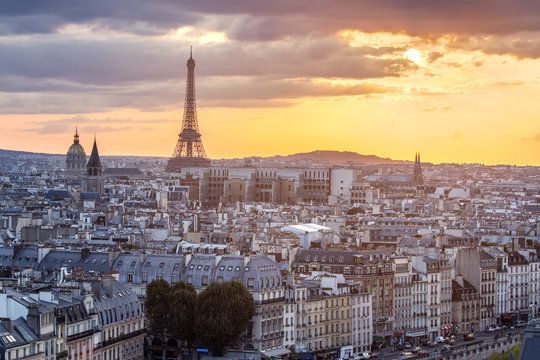 View of Paris with Eiffel tower silhouette at sunset