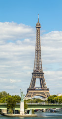 Eiffel Tower and Liberty statue in Paris