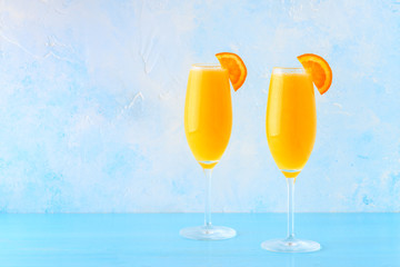 Yellow cocktail on a bright background.