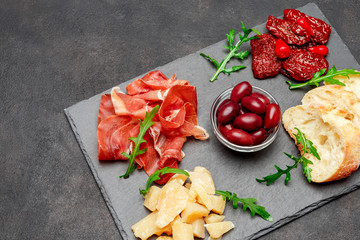 Traditional italian meals - prosciutto crudo or jamon, parmesan, tomatoes