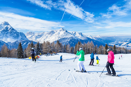 Skiing and snowboarding in high mountains, with Trentino Alto Adige's peaks in the background, San Candido. Italy