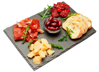 Traditional italian meals - prosciutto crudo or jamon, parmesan, tomatoes