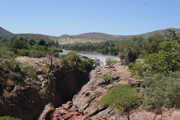 Fototapeta na wymiar A view of the beautiful Epupa Falls on the border of Namibia and Angola. Africa