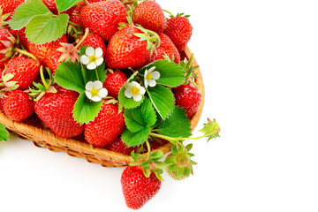 Appetizing strawberries in a wicker basket isolated on white background. Free space for text.
