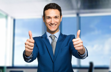 Businessman giving two thumbs up