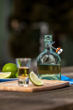 Tequilla inside glass and bottle