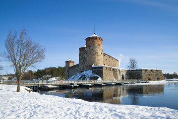 The ancient Olavinlinna fortress in the winter landscape. Savonlinna, Finland