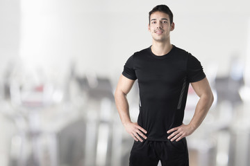 Fototapeta premium Personal Trainer With Hands on Waist
