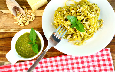 Basil Pesto Pasta on wooden background.
Pasta menu