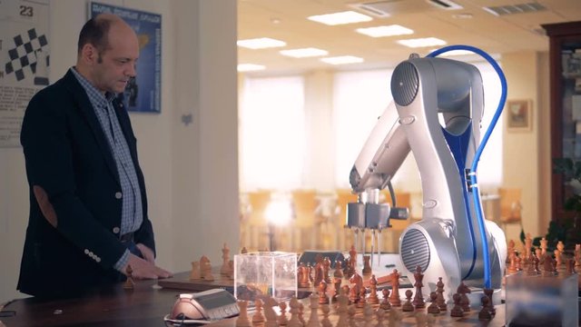 Chess player playing chess with artificial intelligence.