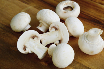 Agaricus bisporus or portobello mushroom on wooden floor