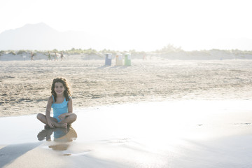 Fototapeta premium little girl vacationing on the beach