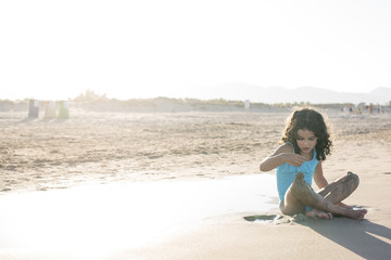 little girl vacationing on the beach
