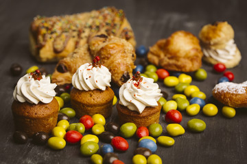 Set of cakes on a dark background.