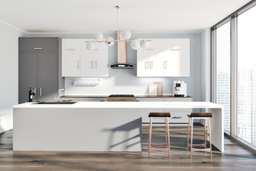 White kitchen, gray counters, table