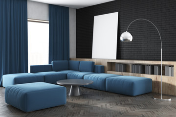 Black wall living room, blue sofa, poster, side