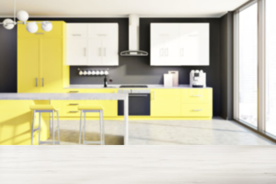 Gray kitchen, yellow counters, table blur