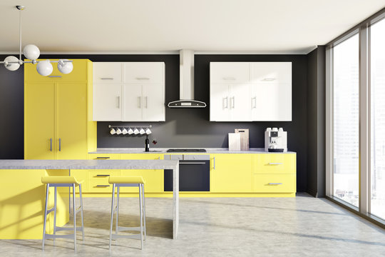 Gray kitchen, yellow counters, table