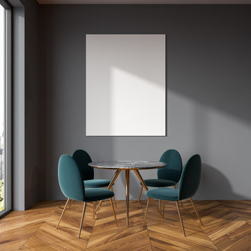 Gray dining room, blue chairs, poster
