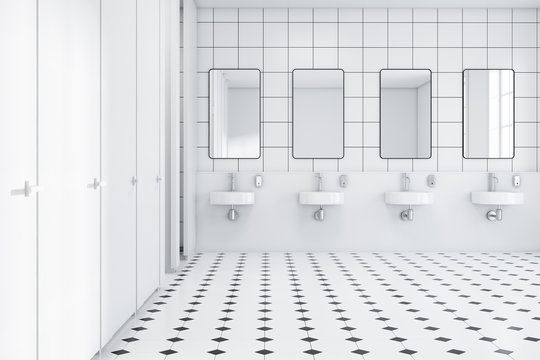 White wall public restroom interior, sinks