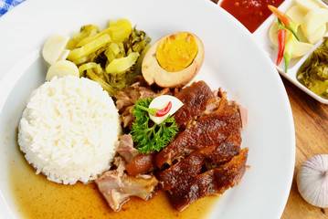 Stewed Pork and Egg with rice and vegetable. (Thai name is Kao ka moo)
Thai street food menu